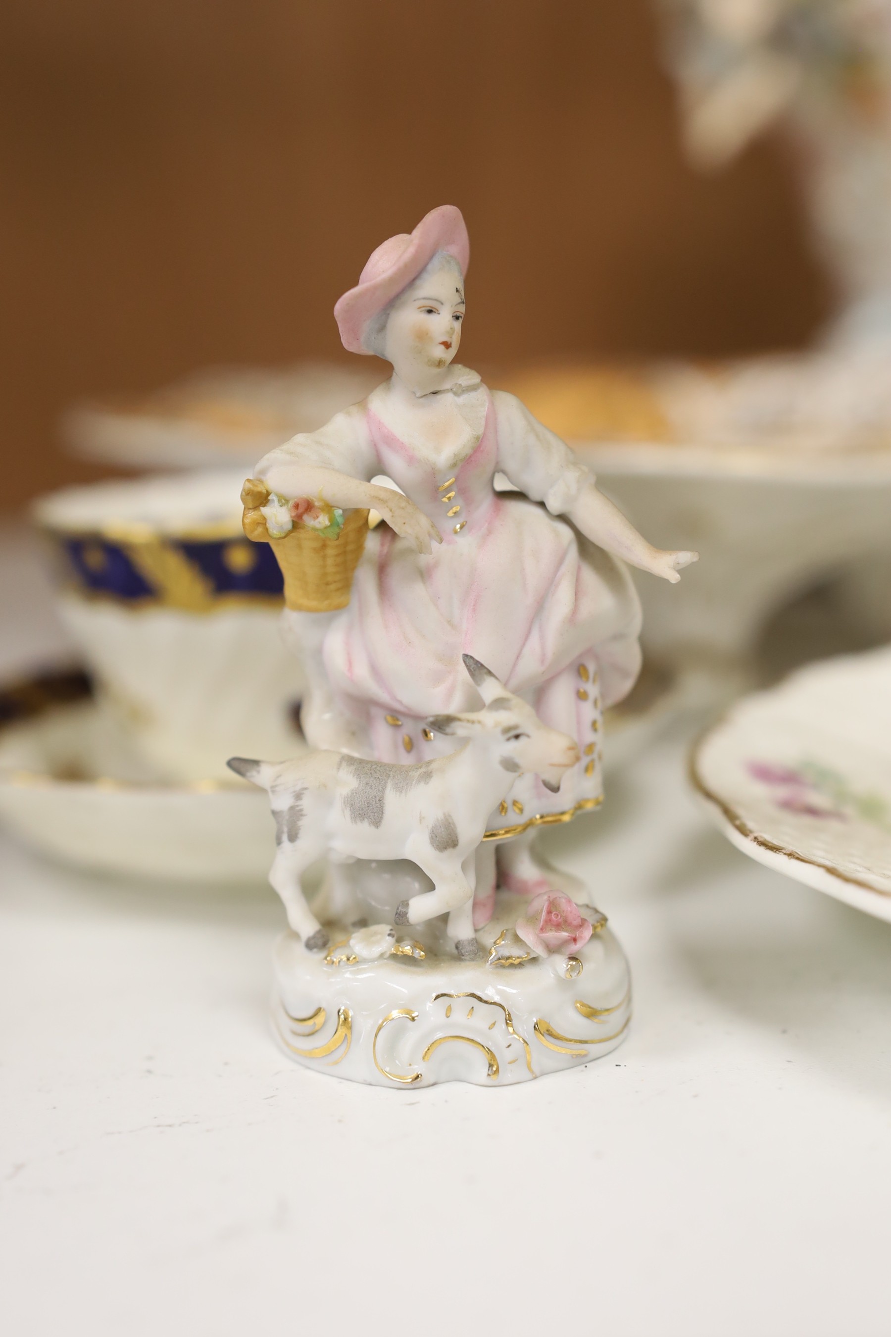 A mixed collection of floral encrusted 19th century and later Continental porcelain